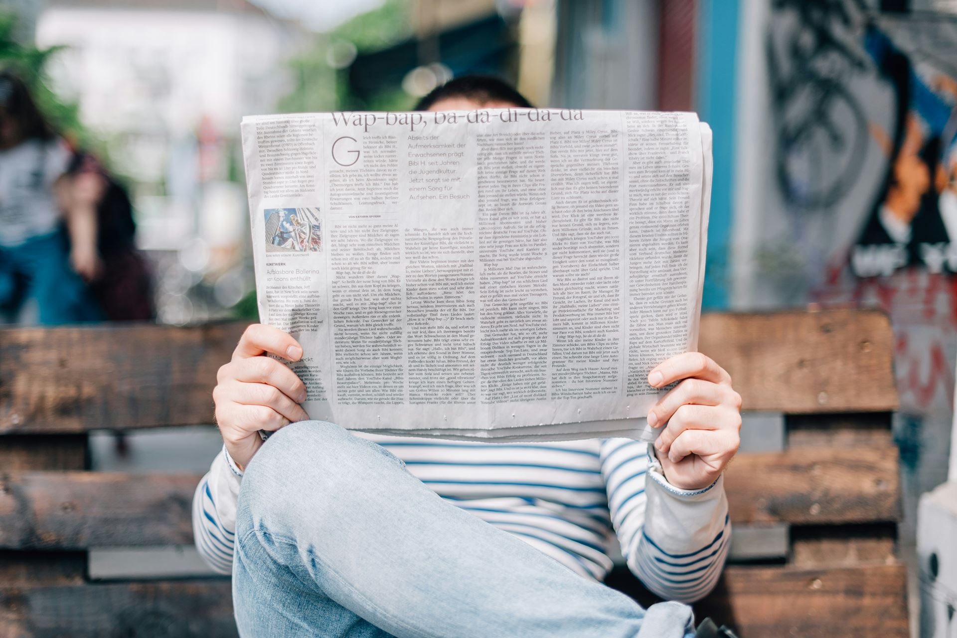 person reading a newspaper